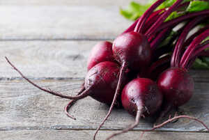 beetroot on a wooden work surface beetroot on a wooden work surface