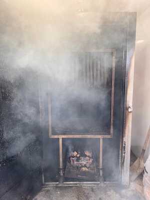 eels hanging in a smoker